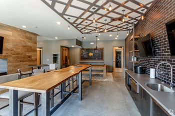 24-Hour resident lounge with kitchenette and tv/gaming area